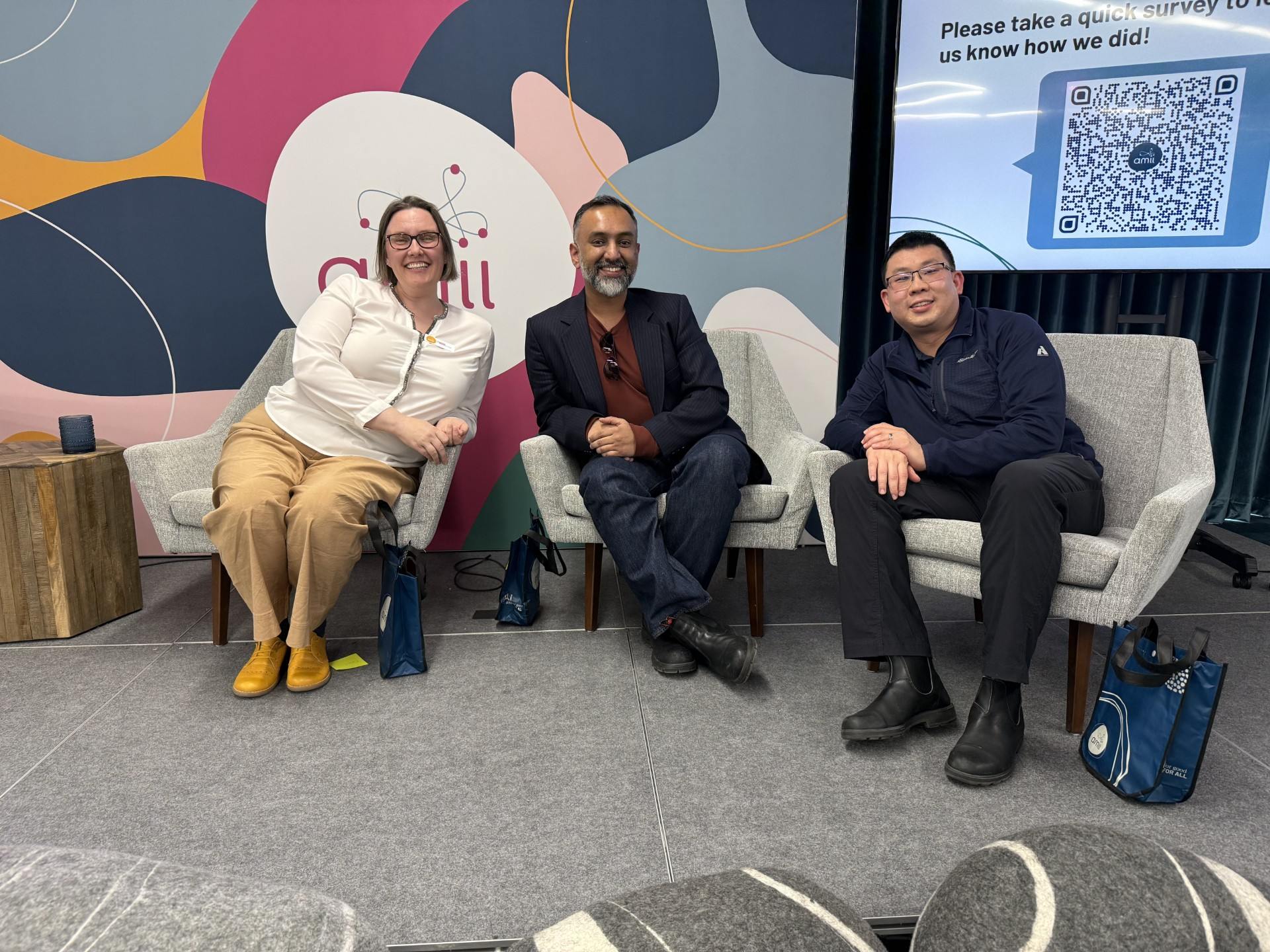 Dr. Avi Sheshachalam speaking on panel at AMII National AI Literacy Day, March 2026, alongside Dr. Carrie Demmans Epp (University of Alberta) and Allan Cheung (Enbridge)